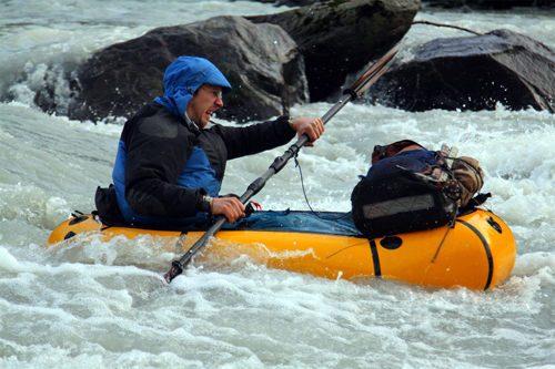 pack rafting in a rapid
