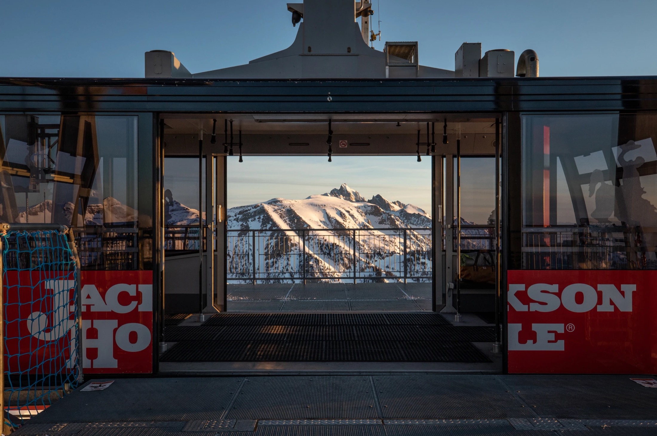 Jackson Hole tram doors open onto a snowy mountain